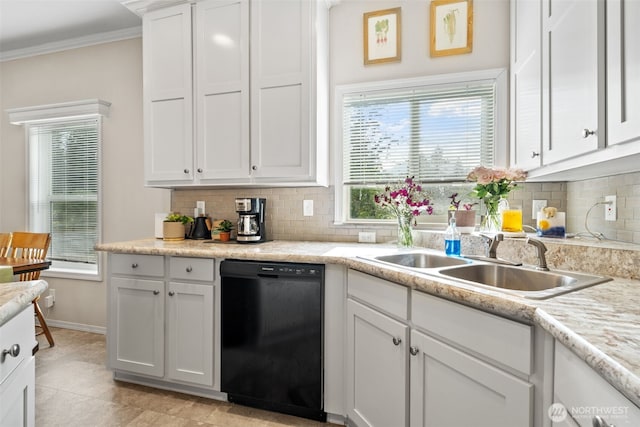 20318 E 67th Ave E, Spanaway, WA 98387 - kitchen featuring black dishwasher, a sink, tasteful backsplash, light countertops, and ornamental molding