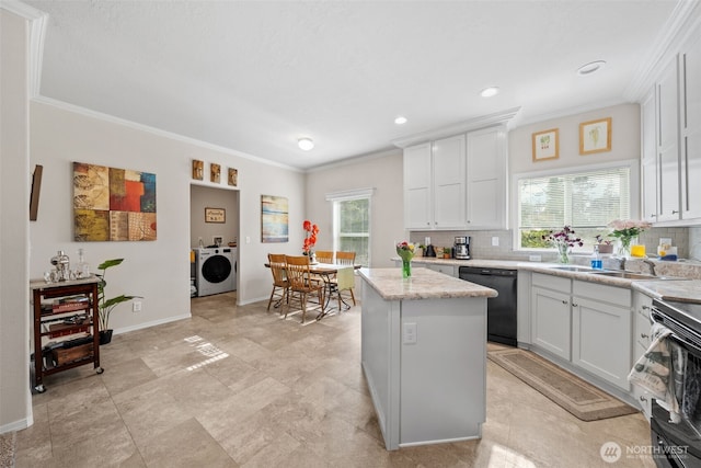 20318 E 67th Ave E, Spanaway, WA 98387 - kitchen with dishwasher, washing machine and dryer, plenty of natural light, ornamental molding, and tasteful backsplash