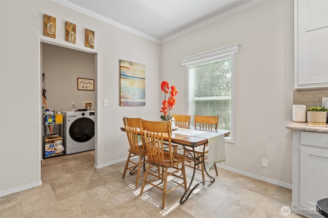 20318 E 67th Ave E, Spanaway, WA 98387 - dining room featuring washer / clothes dryer, crown molding, and baseboards