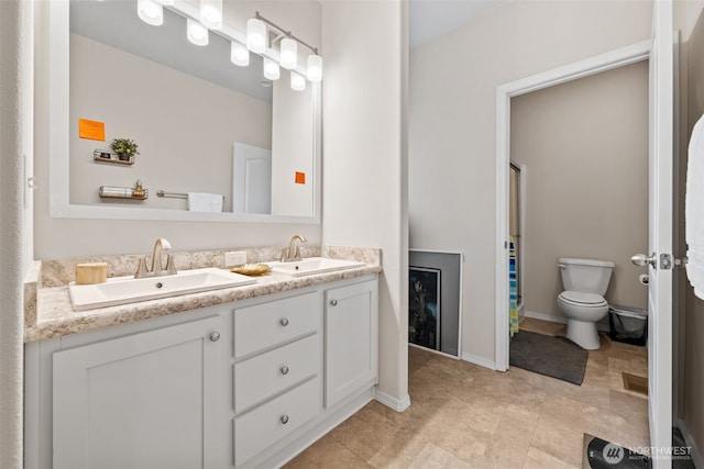 20318 E 67th Ave E, Spanaway, WA 98387 - full bathroom with double vanity, toilet, and curtained shower