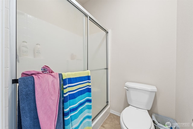 20318 E 67th Ave E, Spanaway, WA 98387 - bathroom with toilet, a stall shower, and baseboards