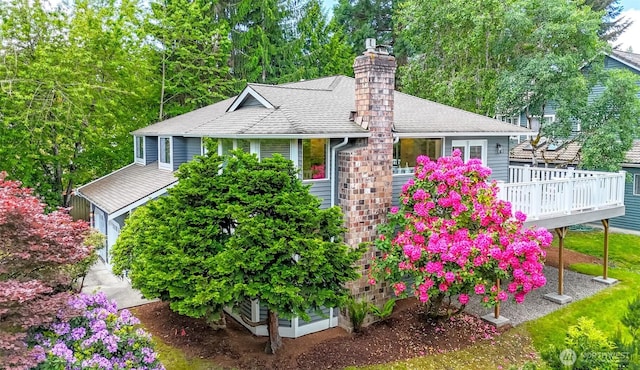 11633 132nd Ct NE, Redmond, WA 98052 - view of front of property with a deck, a chimney, and roof with shingles