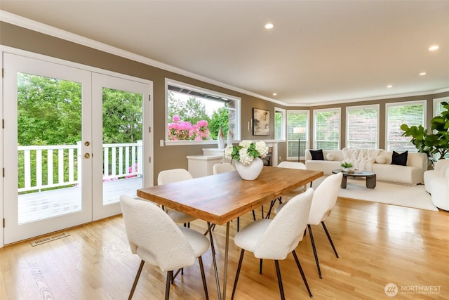 11633 132nd Ct NE, Redmond, WA 98052 - dining space featuring french doors, ornamental molding, recessed lighting, and light wood-type flooring