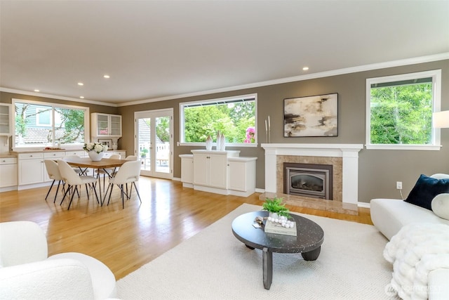 11633 132nd Ct NE, Redmond, WA 98052 - living area with ornamental molding, light wood-style floors, recessed lighting, a fireplace, and baseboards
