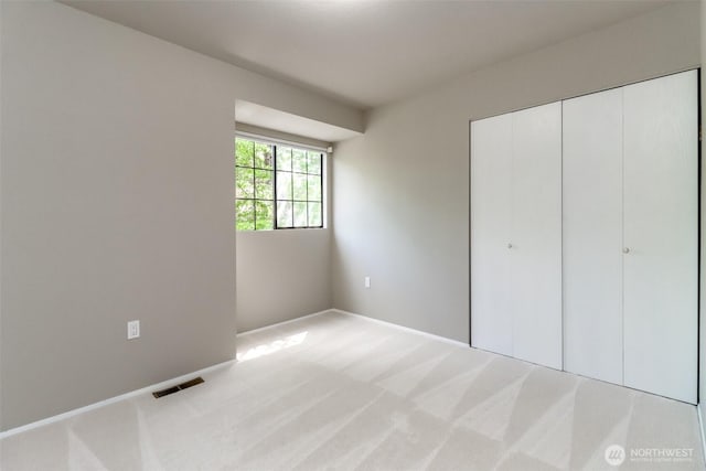 11633 132nd Ct NE, Redmond, WA 98052 - unfurnished bedroom with carpet floors, a closet, and baseboards