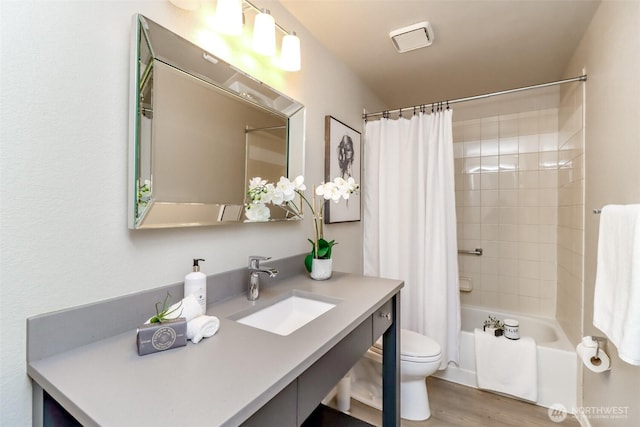 11633 132nd Ct NE, Redmond, WA 98052 - full bathroom featuring vanity, shower / tub combo, wood finished floors, and toilet