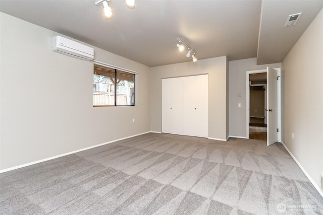11633 132nd Ct NE, Redmond, WA 98052 - unfurnished bedroom with a wall mounted AC, track lighting, carpet, and a closet