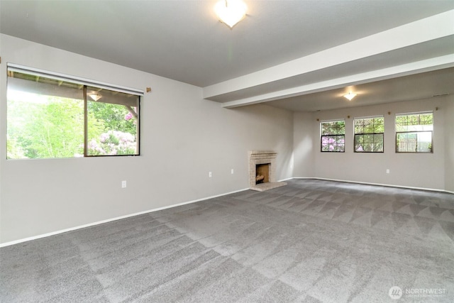 11633 132nd Ct NE, Redmond, WA 98052 - unfurnished living room featuring carpet flooring, a fireplace with raised hearth, and baseboards