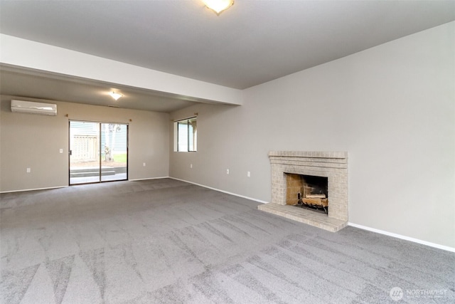 11633 132nd Ct NE, Redmond, WA 98052 - unfurnished living room featuring a wall unit AC, carpet flooring, baseboards, and a brick fireplace