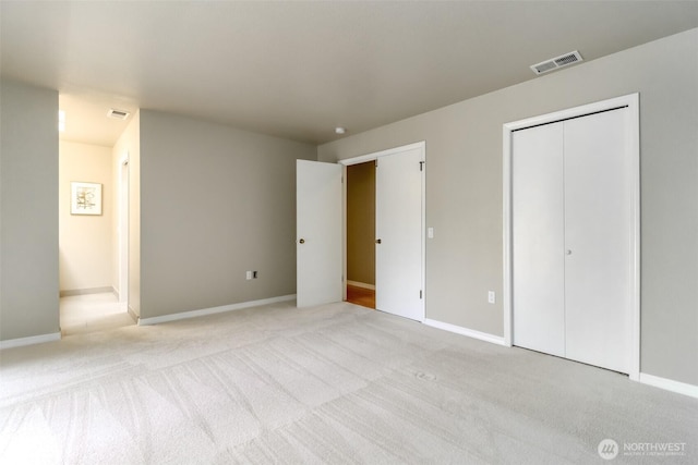 11633 132nd Ct NE, Redmond, WA 98052 - unfurnished bedroom featuring light colored carpet, baseboards, and a closet