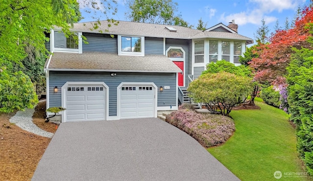 11633 132nd Ct NE, Redmond, WA 98052 - split foyer home featuring asphalt driveway, a garage, a chimney, a front yard, and roof with shingles