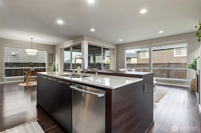 5614 Douglas Ave SE, Auburn, WA 98092 - kitchen with stainless steel dishwasher, a sink, a center island with sink, light countertops, and recessed lighting