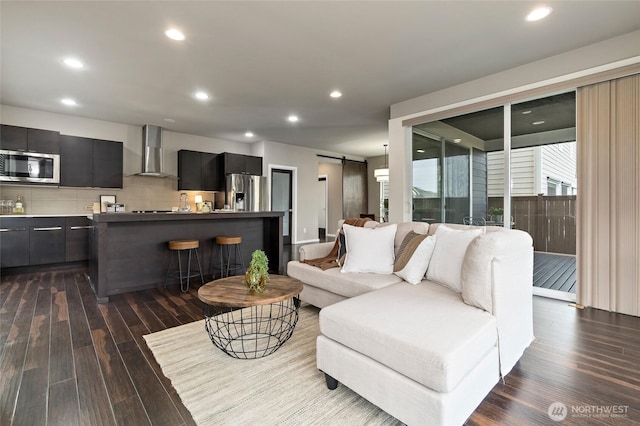 5614 Douglas Ave SE, Auburn, WA 98092 - living area with a barn door, dark wood finished floors, and recessed lighting