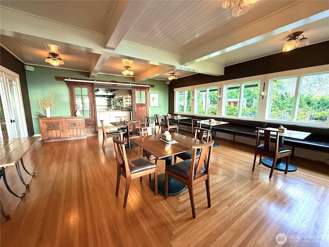 2579 W Shore Dr, Lummi Island, WA 98262 - dining room featuring plenty of natural light, beam ceiling, wood finished floors, and coffered ceiling