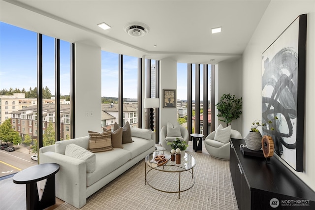 999 110th Ave NE Unit 600, Bellevue, WA 98004 - living room featuring floor to ceiling windows and plenty of natural light