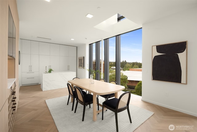999 110th Ave NE Unit 600, Bellevue, WA 98004 - dining space with a wall of windows and baseboards