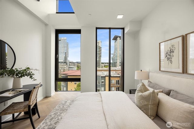 999 110th Ave NE Unit 600, Bellevue, WA 98004 - bedroom with floor to ceiling windows and multiple windows