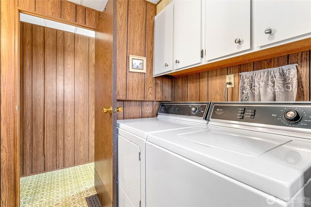5142 Seaview Dr, Blaine, WA 98230 - laundry room featuring cabinet space, washing machine and clothes dryer, and wooden walls