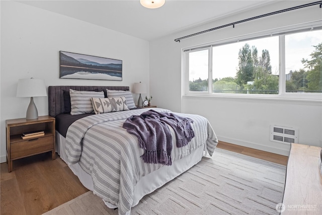 2524 Boyer Ave E Unit 108, Seattle, WA 98102 - bedroom with wood finished floors and baseboards