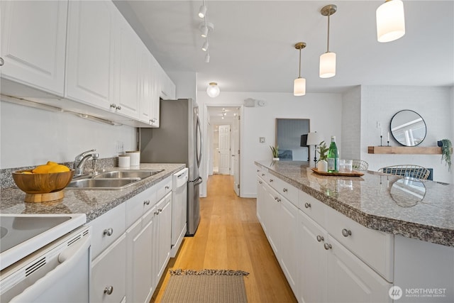 2524 Boyer Ave E Unit 108, Seattle, WA 98102 - kitchen with a sink, white cabinetry, light wood-type flooring, hanging light fixtures, and dishwashing machine