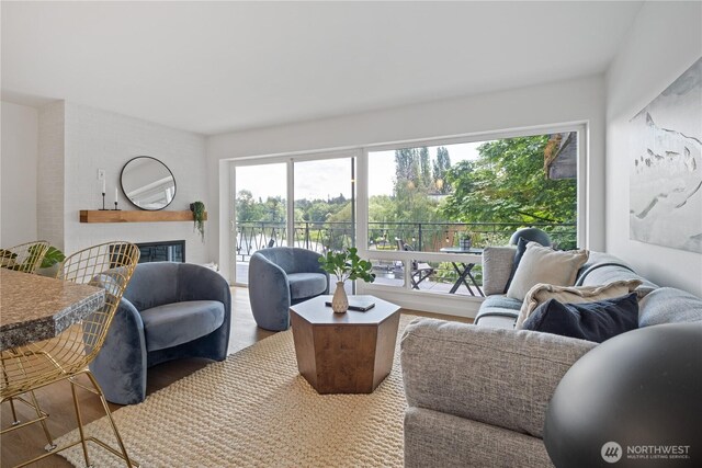 2524 Boyer Ave E Unit 108, Seattle, WA 98102 - living room with wood finished floors and a brick fireplace