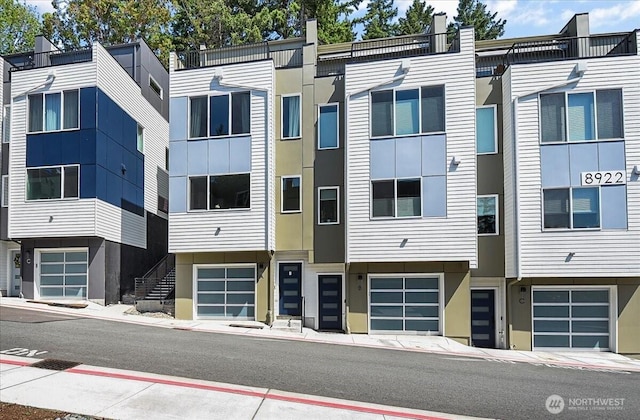 8922 NE 173rd Pl Unit A, Bothell, WA 98011 - view of building exterior featuring an attached garage