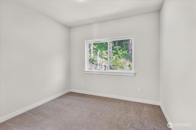 8922 NE 173rd Pl Unit A, Bothell, WA 98011 - carpeted spare room featuring baseboards