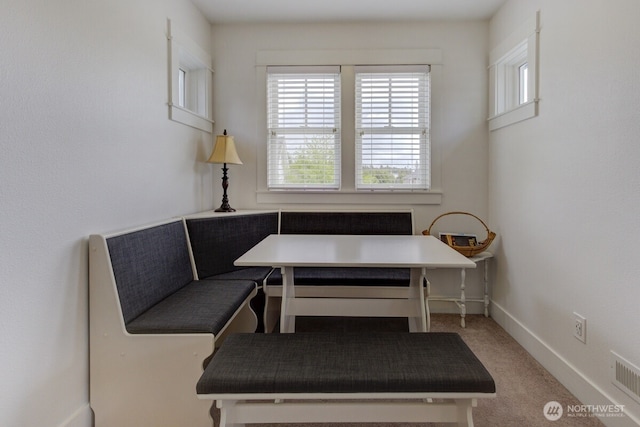 34 Seastar Ln, Pacific Beach, WA 98571 - carpeted dining area featuring breakfast area, radiator heating unit, and baseboards