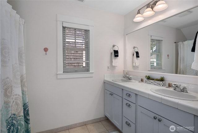 34 Seastar Ln, Pacific Beach, WA 98571 - full bath featuring double vanity, tile patterned flooring, and baseboards