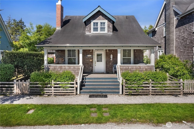 34 Seastar Ln, Pacific Beach, WA 98571 - view of front facade with a porch and a chimney