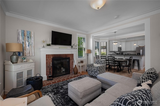 34 Seastar Ln, Pacific Beach, WA 98571 - living area featuring ornamental molding, a brick fireplace, and baseboards