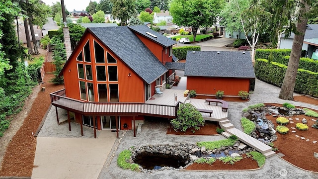 10802 NE 27th Ct, Vancouver, WA 98686 - back of house featuring a shingled roof, a wooden deck, a patio, and driveway