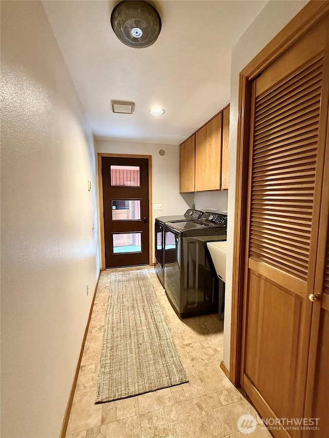 10802 NE 27th Ct, Vancouver, WA 98686 - laundry room featuring separate washer and dryer, cabinet space, and baseboards