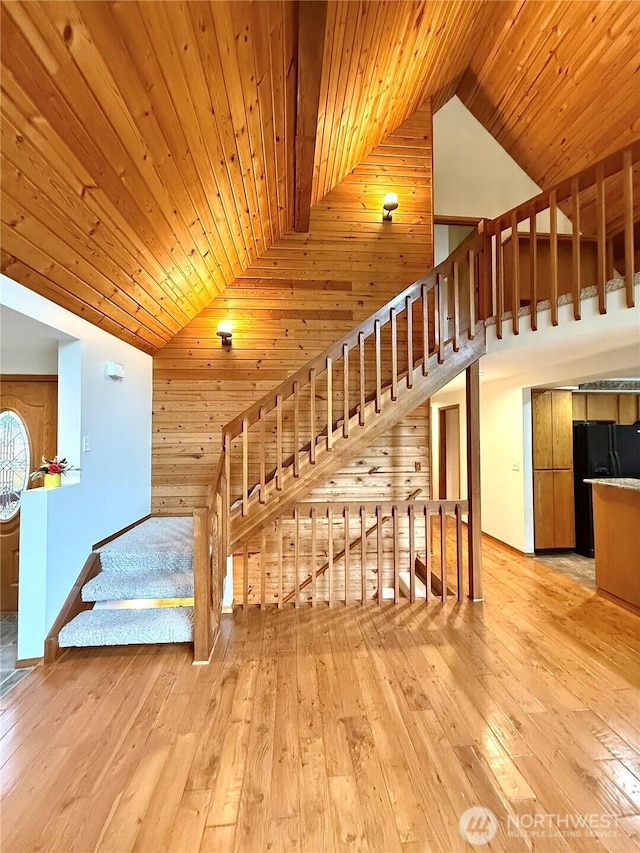 10802 NE 27th Ct, Vancouver, WA 98686 - stairway featuring wooden ceiling, hardwood / wood-style floors, high vaulted ceiling, and wooden walls