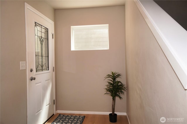 26133 242nd Ave SE, Maple Valley, WA 98038 - doorway with baseboards and wood finished floors
