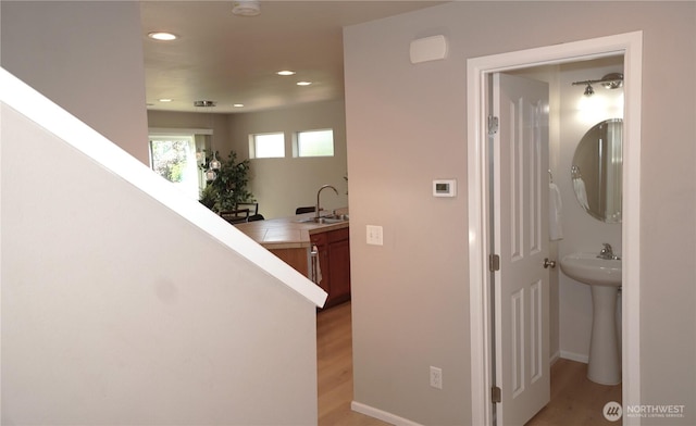 26133 242nd Ave SE, Maple Valley, WA 98038 - hall with a sink, light wood-type flooring, and recessed lighting