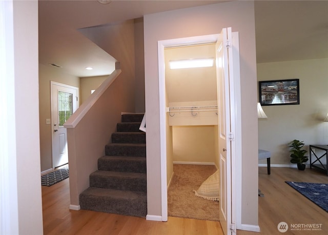 26133 242nd Ave SE, Maple Valley, WA 98038 - stairway featuring wood finished floors and baseboards