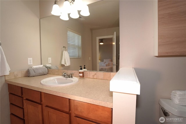 26133 242nd Ave SE, Maple Valley, WA 98038 - bathroom featuring a chandelier, toilet, and vanity