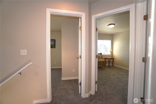 26133 242nd Ave SE, Maple Valley, WA 98038 - hallway featuring dark colored carpet, baseboards, and an upstairs landing