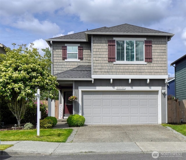 26133 242nd Ave SE, Maple Valley, WA 98038 - view of front facade with driveway, an attached garage, and a shingled roof