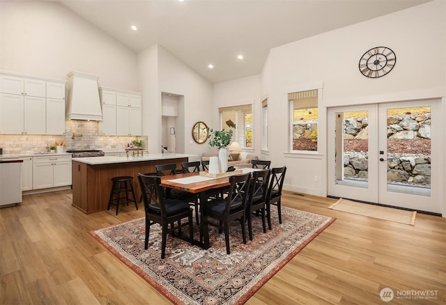 11407 73rd Ave NE, Arlington, WA 98223 - dining area with high vaulted ceiling, light wood finished floors, french doors, and recessed lighting