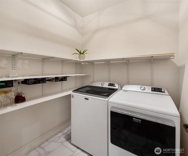 11407 73rd Ave NE, Arlington, WA 98223 - laundry room with light marble finish flooring and washing machine and dryer