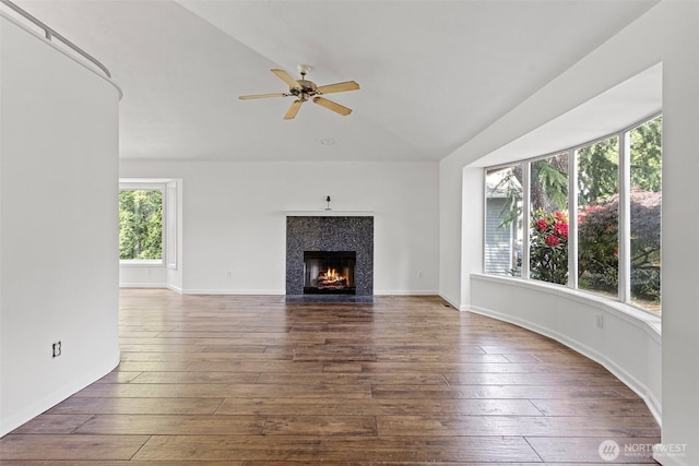 26005 225th Ct SE, Maple Valley, WA 98038 - unfurnished living room with vaulted ceiling, hardwood / wood-style flooring, a high end fireplace, and a ceiling fan