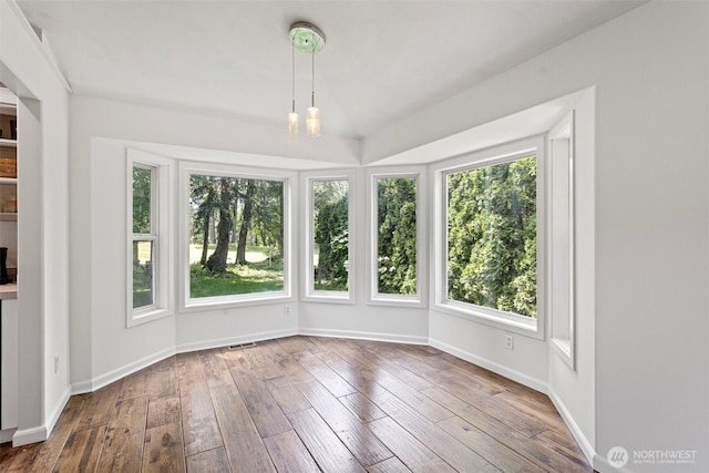 26005 225th Ct SE, Maple Valley, WA 98038 - unfurnished sunroom featuring plenty of natural light, wood-type flooring, and baseboards