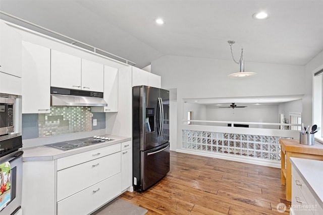 26005 225th Ct SE, Maple Valley, WA 98038 - kitchen with appliances with stainless steel finishes, under cabinet range hood, light countertops, ceiling fan, and white cabinets