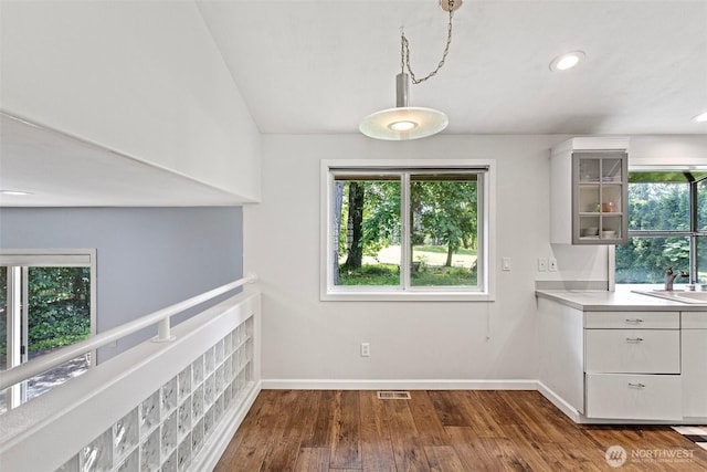 26005 225th Ct SE, Maple Valley, WA 98038 - unfurnished dining area featuring healthy amount of natural light, dark wood-style floors, baseboards, a sink, and recessed lighting