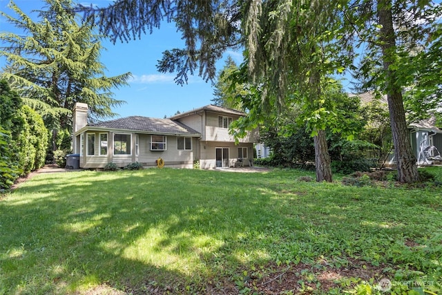 26005 225th Ct SE, Maple Valley, WA 98038 - back of house featuring a chimney and a yard