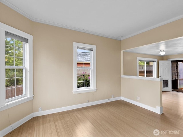 4116 25th Ave SW, Seattle, WA 98106 - spare room with wood finished floors, crown molding, and baseboards