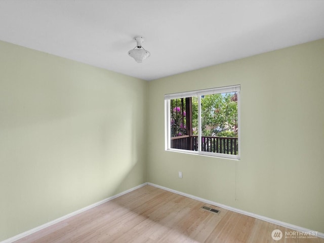 4116 25th Ave SW, Seattle, WA 98106 - unfurnished room featuring wood finished floors and baseboards