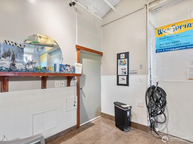 4116 25th Ave SW, Seattle, WA 98106 - entrance foyer with baseboards, tile patterned flooring, and high vaulted ceiling